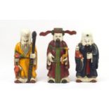 Three large Chinese hand painted carved wood Gods comprising prosperity, Longevity and happiness,