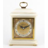Elliott alabaster mantel clock retailed by W Bruford & Son, with ornate dial and silvered chapter