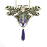 Egyptian Revival white metal and enamel moth pendant set with lapis lazuli on a necklace, the