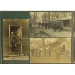 Early 20th century photographs and postcards, some Military arranged in two albums including Royal