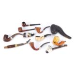 Antique and later pipes, some silver mounted including a Meerschaum bowl in the form of a hand