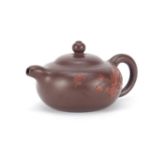 Chinese yixing terracotta teapot decorated with relief with an insect beside flowers, script to