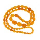 Butterscotch amber colour bead necklace, 90cm in length, 75.4g :For Further Condition Reports Please