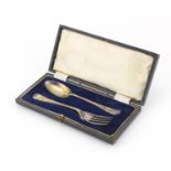 Silver Christening fork and spoon set by Joseph Rodgers & Sons, housed in a fitted tooled leather
