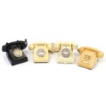 Four vintage Bakelite dial telephones including a cream GPO example with base drawer :For Further