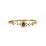 9ct gold garnet bangle, 6cm wide, 6.2g :For Further Condition Reports Please Visit Our Website.