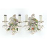 Pair of German porcelain floral encrusted two branch wall sconces by Dresden, each 23cm high :For
