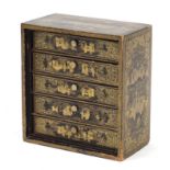 Chinese black lacquered five drawer chest with ivory handles, finely gilded with figures and