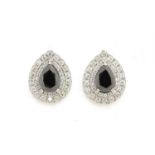 Pair of 18ct white gold pear shaped black and white diamond earrings, 2.4cm in length, 10.2g :For