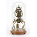 Gothic style brass skeleton clock with fusee movement, housed under a glass dome, overall 39cm