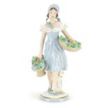 Royal Dux figurine of a girl holding baskets of flowers, with paper label, 27cm high :For Further