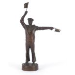 Art Deco style patinated bronze figure of a sailor holding two flags, indistinctly impressed