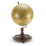 Philips 12inch terrestrial globe raised on a stained mahogany base, 52cm high :For Further Condition