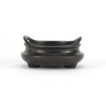 Chinese bronze tripod censer with twin handles, impressed character marks to the base, 9cm in
