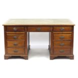 Mahogany twin pedestal captain's desk with tooled leather insert above a series of drawers and