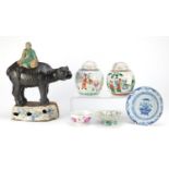 Chinese ceramics including a large boy on a buffalo incense burner, footed famille rose dish and two