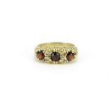 9ct gold garnet and clear stone ring, size K, 3.5g :For Further Condition Reports Please Visit Our