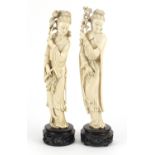 Good pair of Chinese ivory carvings of Guanyin holding flowers, both raised on carved hardwood