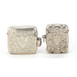 Two Edwardian silver vest's with engraved decoration, Birmingham hallmarks, the largest 4cm in
