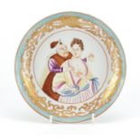 Chinese porcelain shallow dish, hand painted with European figures within a gilt border, 21cm in