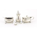 Silver three piece cruet, housed in a fitted tooled leather box, Birmingham 1959, the largest 7.