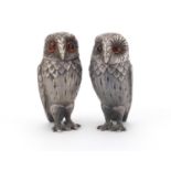 Pair of novelty silver pepperette's in the form of owls by William Comyns, each with beaded glass