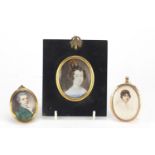 Three Oval portrait miniatures including one of an Art Deco female housed in an unmarked gold