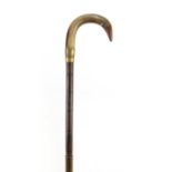 Horn handled walking stick with brass collar, possibly rhinoceros horn, 88cm in length :For