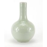 Chinese celadon glazed bottle vase, incised under glaze with flower heads and foliage, character