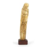 Good Chinese ivory carving of Shou Lao raised on rectangular hardwood stand, overall 19cm high :