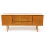 Vintage Beautility teak concave sideboard with two cupboard doors and three central drawers, 79cm