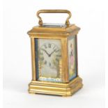 Miniature brass cased carriage clock with Sèvres style panels, hand painted with females and