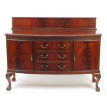 Chippendale style mahogany bow front sideboard fitted with two cupboard doors and three central