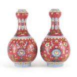 Pair of Chinese porcelain garlic neck vases, each finely hand painted in the famille rose palette
