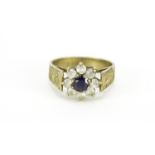 9ct gold blue and clear stone flower head ring, size M, 3.0g :For Further Condition Reports Please