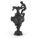 19th century classical patinated bronze ewer with merman handle, the body cast in relief with