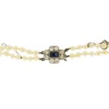 Two string pearl necklace with unmarked white gold sapphire and diamond clasp, 34cm in length, 21.8g