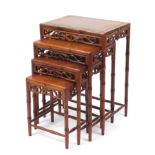 Chinese hardwood quarteto nest of four occasional tables with simulated legs, the largest 69cm H x