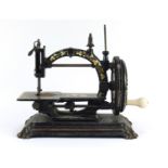 Rare 19th century cast iron Todd's Champion hand operated sewing machine with paw feet, gilded