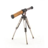 Novelty miniature model of a telescope on tripod base, impressed marks 925, 9.5cm high :For