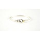 Tiffany & Co sterling silver and 18ct gold love knot hook eye bracelet, 6cm x 5.5cm, 9.6g :For