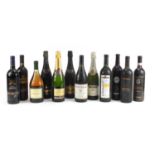 Twelve bottles of mostly red wine and champagne including Martini, Freixenet, Cava, Cabernet