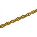 Good quality 14ct gold rope twist bracelet set with diamonds and rubies, P V makers mark, 18cm in