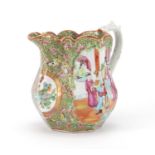 Chinese Canton porcelain jug hand painted in the famille rose palette with figures, birds,