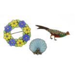 Three silver and enamel brooches including a marcasite pheasant, the largest 4.5cm in diameter, 27.