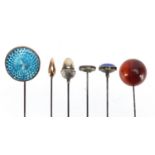 Six vintage hat pins including a 9ct gold example and three with enamel, the largest 26cm in