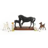 Three Beswick horses and two Beatrix Potter figures including Black Beauty and Foal, the largest