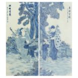 Pair of Chinese blue and white porcelain panels housed in hardwood frames, decorated in relief