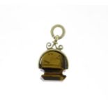 Tiger's eye fob engraved with a huntsman and dog, 2.5cm high, 2.3g :For Further Condition Reports