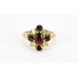 9ct gold garnet flower head ring, size N, 3.6g :For Further Condition Reports Please Visit Our